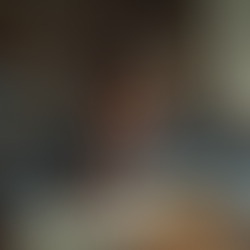 Eye-level view of a student reading a classic novel at a desk