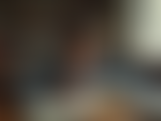 Eye-level view of a student reading a classic novel at a desk