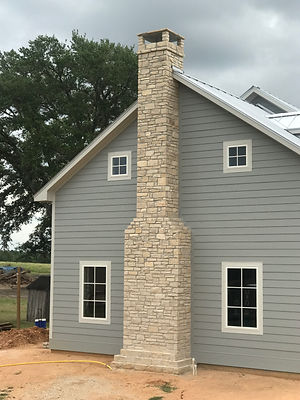 two-story-grey-with-chopped-stone-chimne