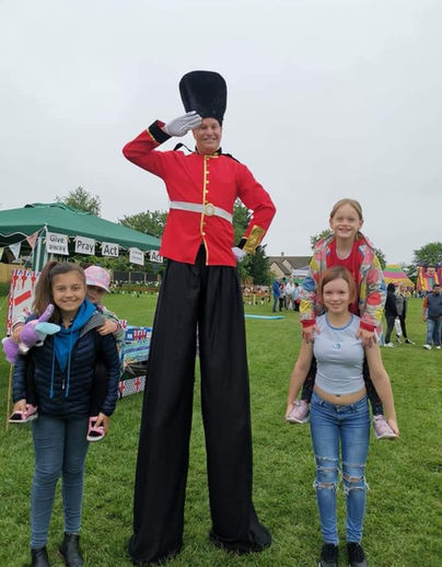 Professional stilt walker performing at a event – ideal for festivals, parties, and outdoor entertainment hire in the UK