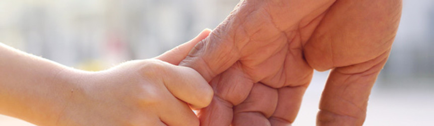 young hand holding old and