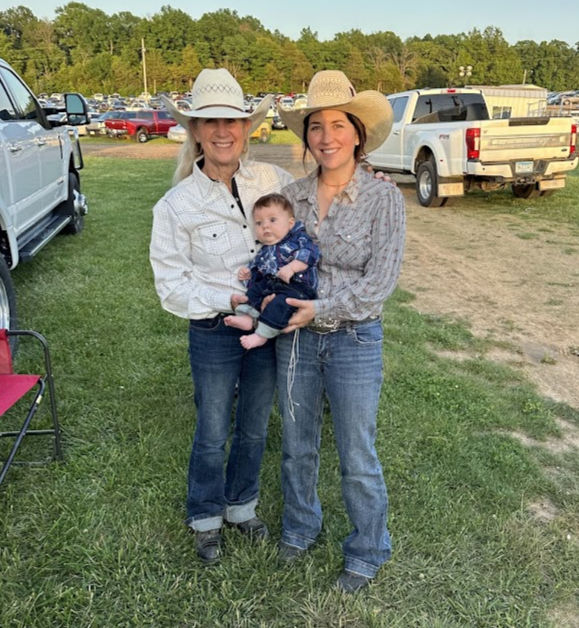 Sharon, Camarie and her son Flynn at her first rodeo back after having him. Camarie's parents have always been her biggest supporters!