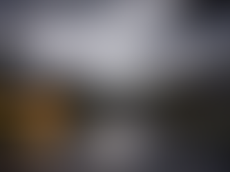 Street after storm. Only one house has lights.