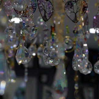 closeup shot of glistening gems hanging from the ceiling