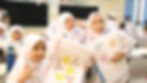 Beberapa murid mempertunjukkan gambar mereka