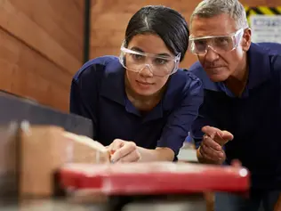 Two employees developing their in-house training program