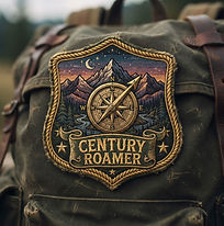 Embroidered adventure badge with gold metallic border, featuring a '100' distance typography icon