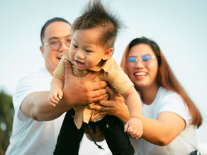 parents playing with baby born via surrogacy with Atlas Mexico