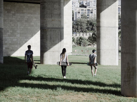 skaters under a bridge
