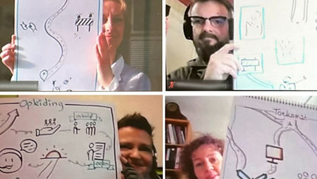 Deelnemers aan de workshop zakelijk tekenen laten hun eigen gemaakte praatplaat zien