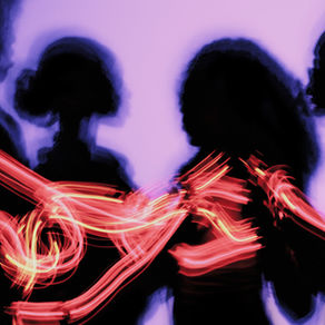 black silhouettes on a purple background with lines of red and yellow light trails running over them