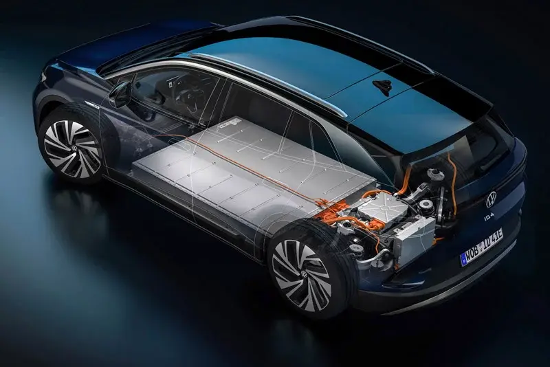 The image shows a modern electric vehicle with the battery pack and powertrain visible, highlighting the vehicle's electric drive system and advanced technology.