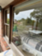 Residential window pane with wooden frame, window cleaning Melbourne