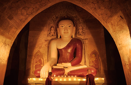 Novice Monks Lighting Candles