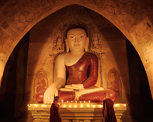 Novice Monks Lighting Candles