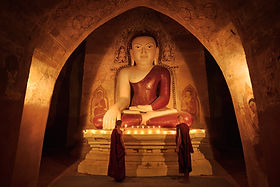 Novice Monks Lighting Candles