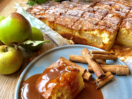 Autumnal apple and cinnamon traybake with salted caramel sauce.