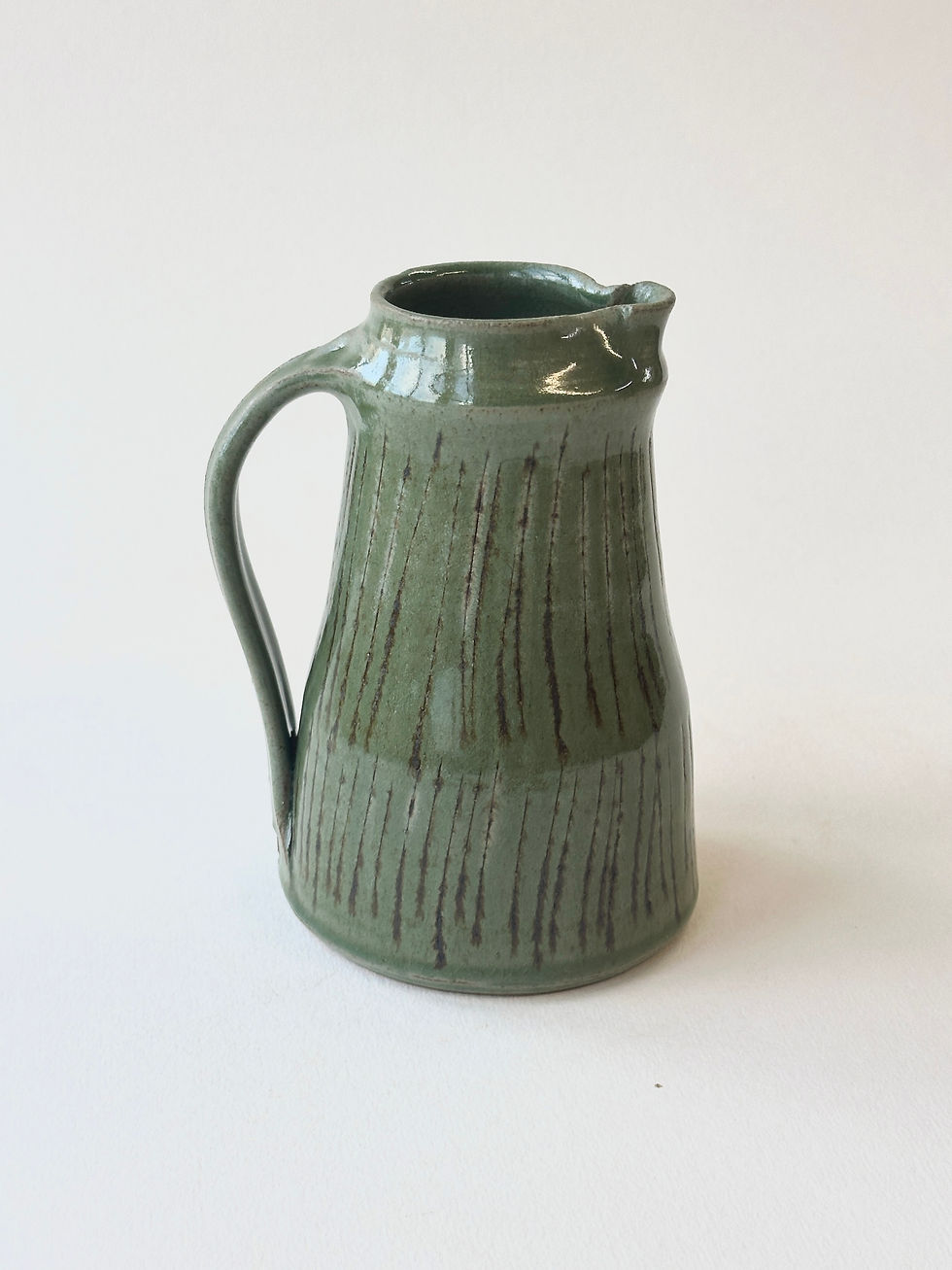 Studio jug mid Green Incised lines