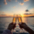cheers at sunset just champagne glasses on the water make with only 2 glasses.jpg