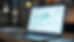 Eye-level view of a laptop screen showing a SaaS dashboard with user analytics