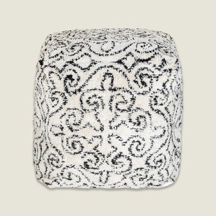 Black and white square floor pouf with a textured tufted damask design.