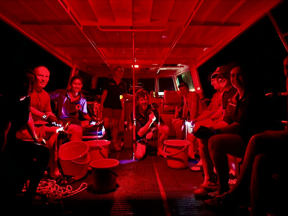 Group of people on board Nemo, on a night sampling evening in the red light