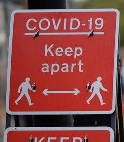A red covid 19 sign