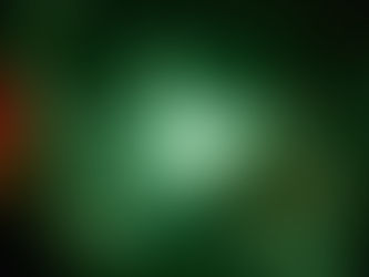 A blurry screen with a white woman staring at a large frog creature