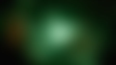 A blurry screen with a white woman staring at a large frog creature