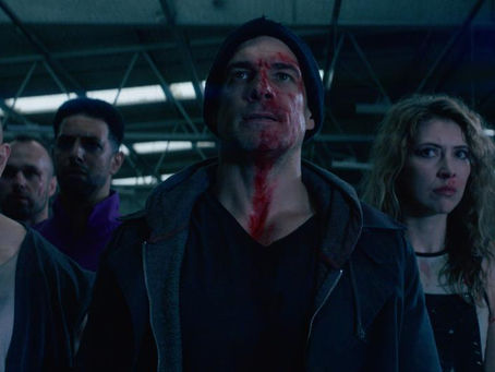 a group of people in varying bloody states