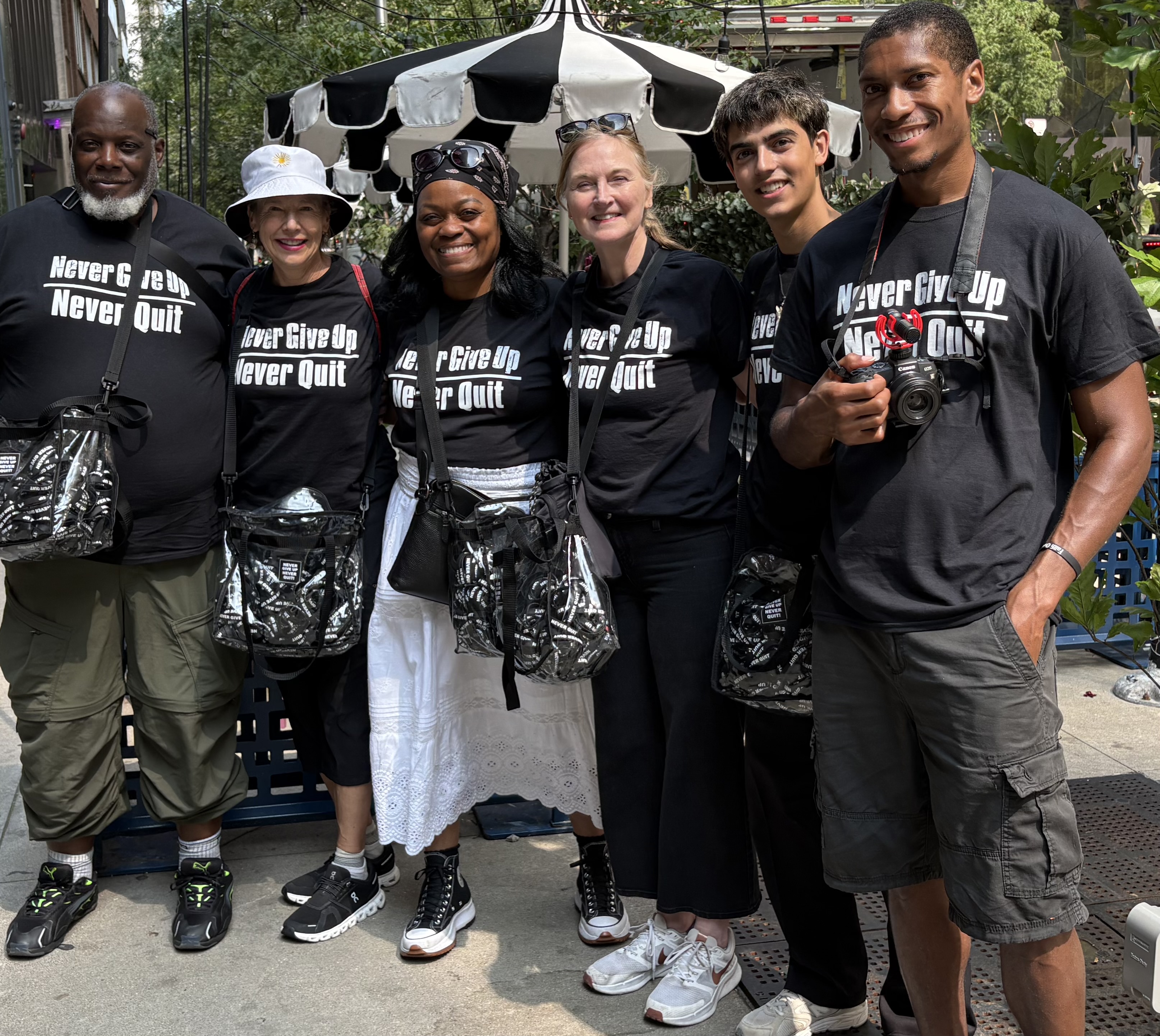 Six members of the Never Give Up Never Quit Chicago street team together outdoors