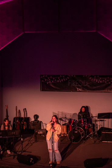 Photo of band playing on stage at a concert