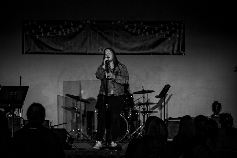 Black and white photo of a girl singing
