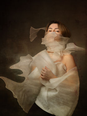 Portrait with translucent fabric slipping and misaligned around the mouth and torso, suggesting structural breakdown.