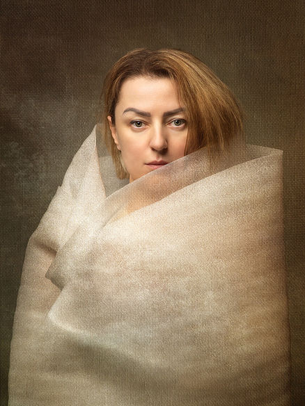 Fine-art portrait of a woman showing tension in the face, silence held inward.