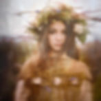 Soft multiple exposure portrait of a woman with floral elements and warm tones, showing refined use of colour and layering