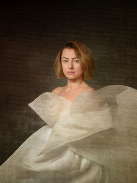 Portrait of a woman with translucent fabric receding from the face, suggesting silence absorbed inward.