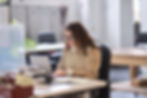 A woman on her computer looking at the income for her trust