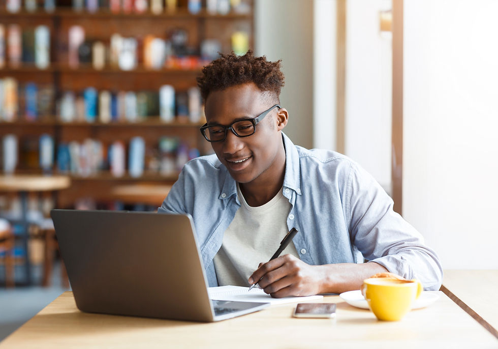 A college student looking at his parents' family office on his computer.