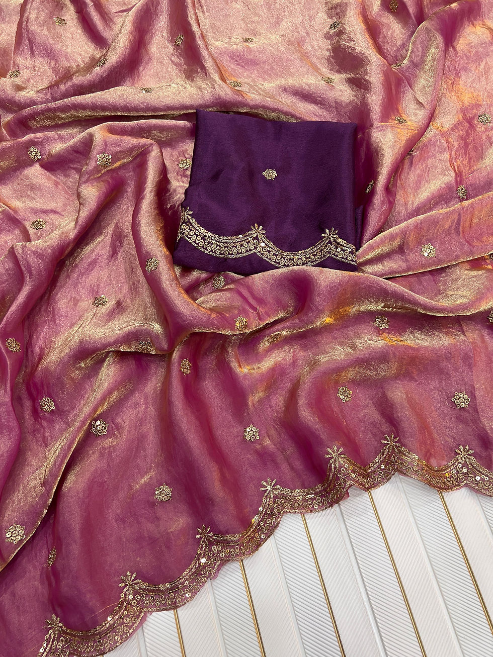 Dazzle at any celebration with this Heavy Space Silk Ready-to-Wear Saree, crafted in a soft, flowy fabric that combines elega