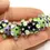 Thumbnail: Black-Green rondelle beads 12mm with raised dots