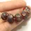 Thumbnail: Red rondelle beads 12mm with lava textured