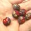 Thumbnail: Red rondelle beads 12mm with lava textured