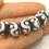Thumbnail: Black rondelle beads 14mm with lava textured