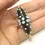 Thumbnail: Black pair cone beads with raised dots