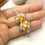 Thumbnail: Orange pair glass beads with raised dots 14mm