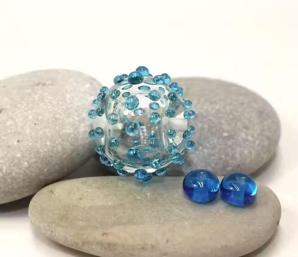 Clear hollow bead with raised dots