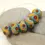 Thumbnail: Artisan rondelle beads 14mm with lava textured