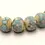 Thumbnail: Ivory rondelle beads 12mm with lava textured