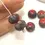 Thumbnail: Red rondelle beads 12mm with lava textured